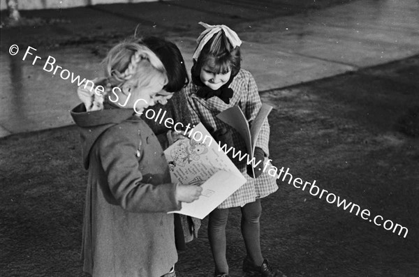 YOUNG GIRLS WITH PICTURE STORY BOOKS